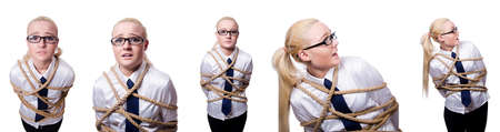 Businesswoman tied up with rope isolated on whiteの写真素材