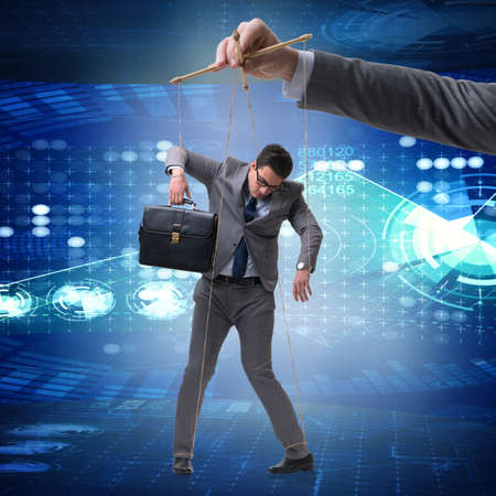 Businessman puppet being manipulated by bossの写真素材