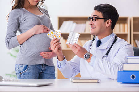 Pregnant woman visiting doctor for consultation