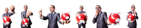 Businessman with piggybank on whiteの写真素材