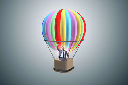 Businessman flying on balloon in challenge conceptの写真素材