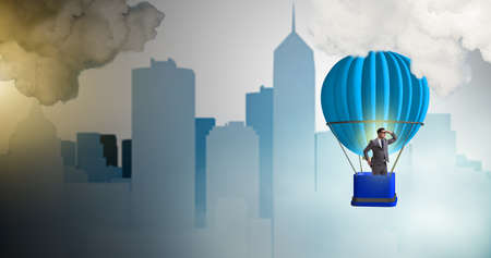 Businessman flying on balloon in challenge concept