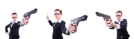 Woman with gun isolated on whiteの写真素材