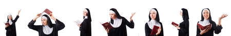 Pretty nun with Bible isolated on whiteの写真素材