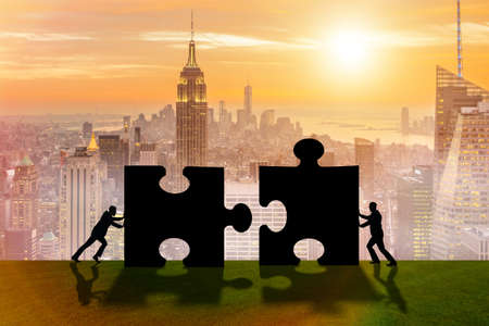 Business metaphor of teamwork with jigsaw puzzleの写真素材