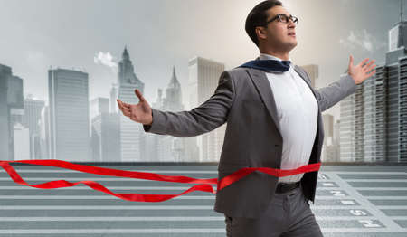 Businessman on the finishing line in competition conceptの写真素材