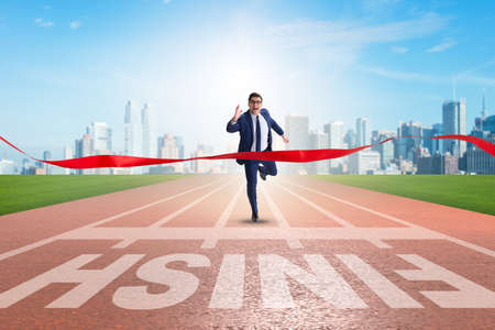 Businessman on the finishing line in competition conceptの写真素材