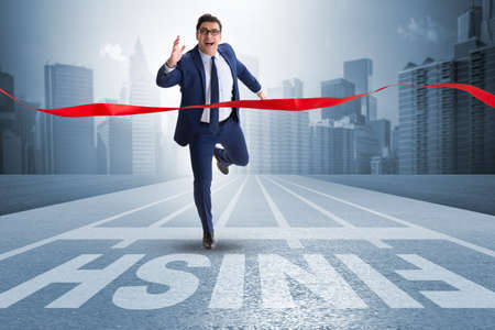 Businessman on the finishing line in competition conceptの写真素材