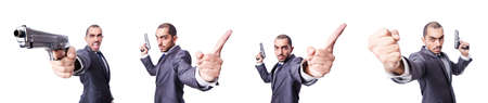 Businessman with gun isolated on whiteの写真素材