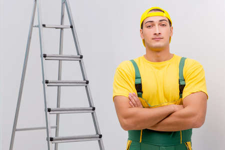 Repairman in coveralls in DIY concept