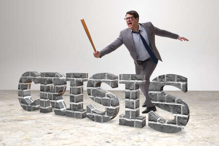 Angry man with baseball bat hitting crisis wordの写真素材