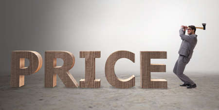 Angry man with axe axing the price wordの写真素材