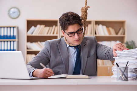 Concept of overworked businessman with noose around his neckの写真素材