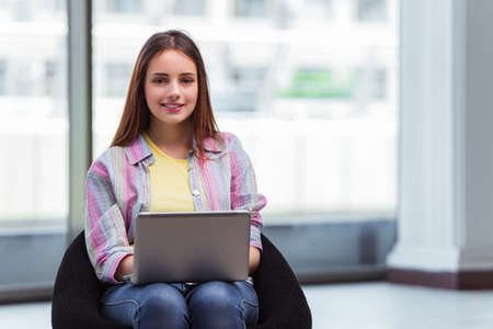 Young girl surfing internet on laptopの写真素材