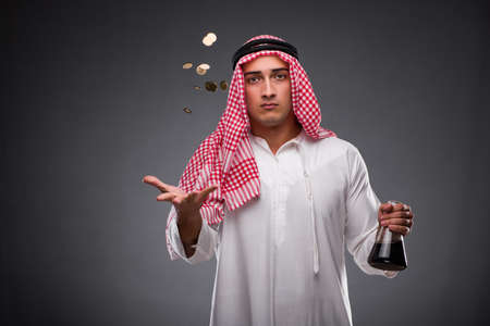 Arab with oil on gray backgroundの写真素材