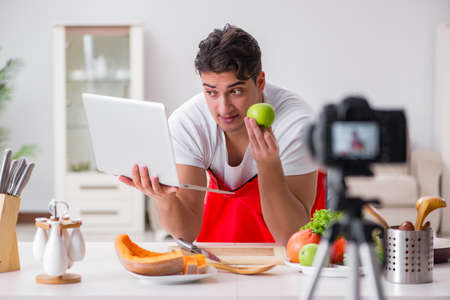 Food blogger working in the kitchenの写真素材