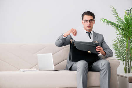 Businessman with briefcase in business conceptの写真素材