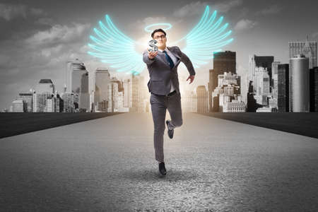 Angel investor concept with businessman with wingsの写真素材