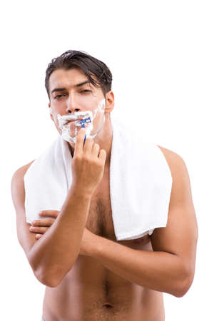 Handsome man shaving isolated on whiteの写真素材