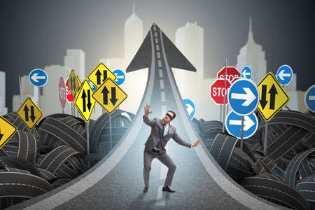 Blindfold businessman on the road unsureの写真素材