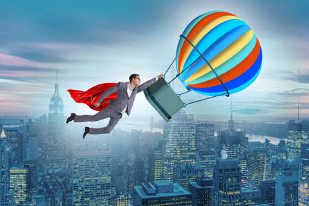 Businessman flying on balloon in challenge conceptの写真素材