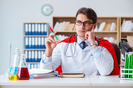 Superhero doctor working in the hospital labの写真素材