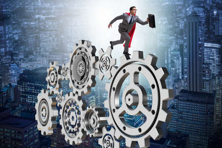 Businessman in teamwork concept with cogwheelsの写真素材