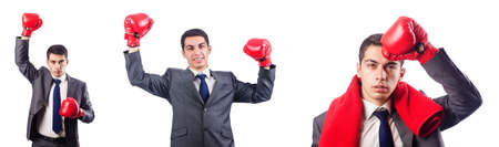 Businessman with boxing gloves on whiteの写真素材