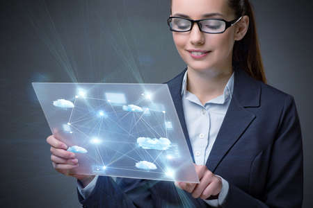 Woman with tablet in cloud computing conceptの写真素材