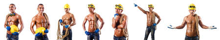 Muscular builder with tools isolated on white