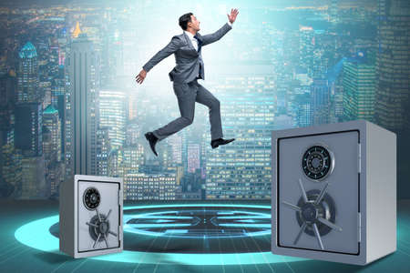 Businessman jumping from safes in business concept