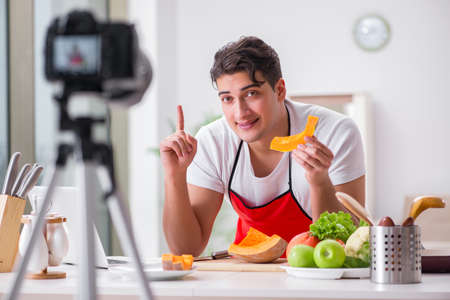 Food blogger working in the kitchenの写真素材
