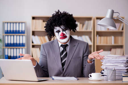 Clown businessman working in the officeの写真素材