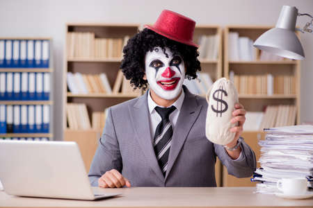 Clown businessman working in the officeの写真素材
