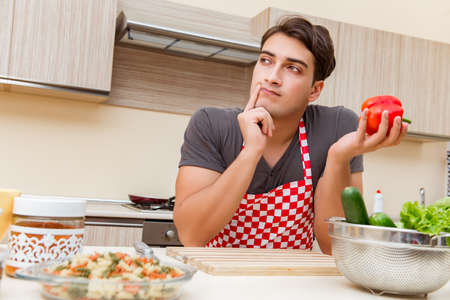 Man male cook preparing food in kitchenの写真素材