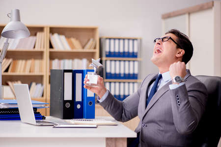 Businessman with star award in officeの写真素材