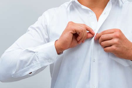 Businessman dressing up for workの写真素材