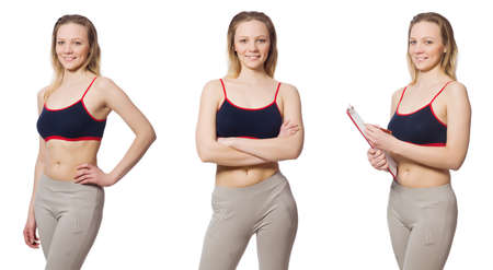 Young female doing exercises on whiteの写真素材