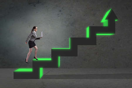 Young businesswoman climbing career ladder