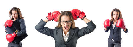 Young woman with boxing gloves isolated on whiteの写真素材