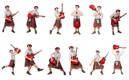 Scotsman playing guitar isolated on whiteの写真素材