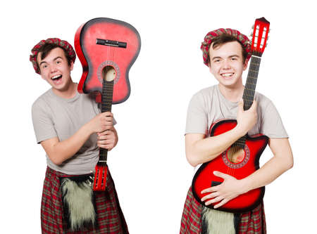 Scotsman playing guitar isolated on whiteの写真素材