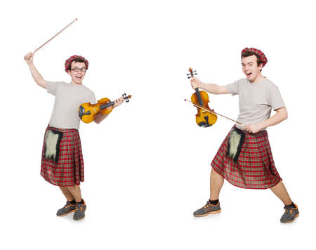 Funny scotsman with musical instrument isolated on whiteの写真素材