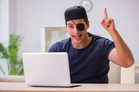 Digital security concept with pirate at computerの写真素材