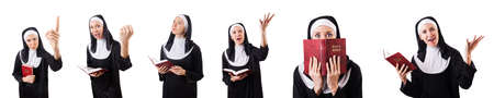 Pretty nun with Bible isolated on white