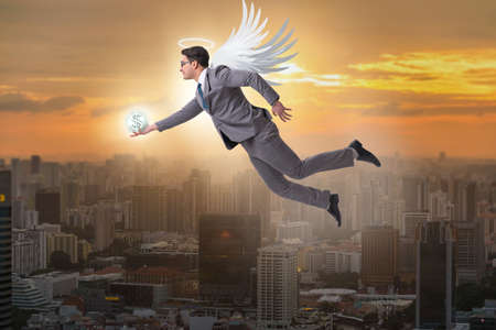 Angel investor concept with businessman with wingsの写真素材