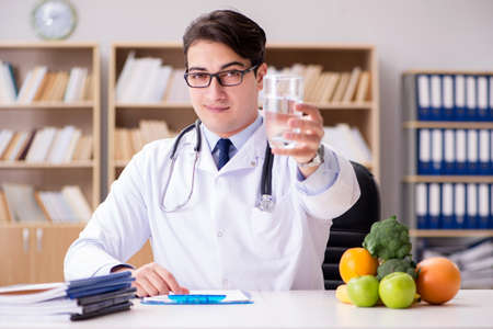 Doctor in dieting concept with fruits and vegetablesの写真素材