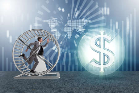 Business concept with businessman running on hamster wheelの写真素材