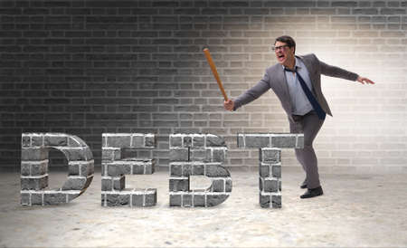 Angry man with baseball bat debt burdenの写真素材