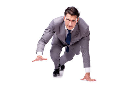 Businessman on start ready for running isolated on whiteの写真素材